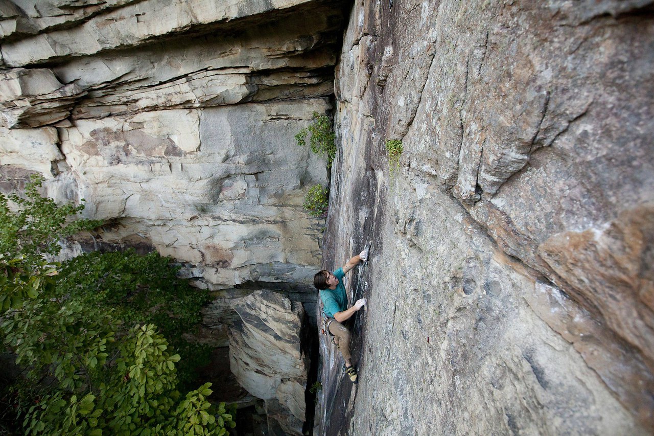 Onsighting Cheap Seats 5.10a this past summer at The Obed, South Clear Creek, Tennessee. Photo by ...